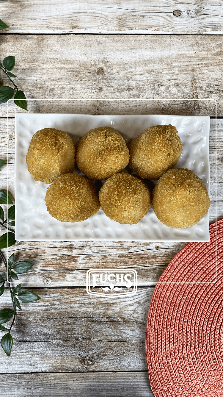 Arancini siciliens dorés et croustillants, boulettes de riz frites farcies à la mozzarella avec origan et basilic lyophilisés Fuchs