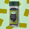 Flacon de baies de genièvre Fuchs avec un bouchon vert, contenant des baies sombres et parfumées, parfaites pour les marinades, gibiers et plats mijotés.